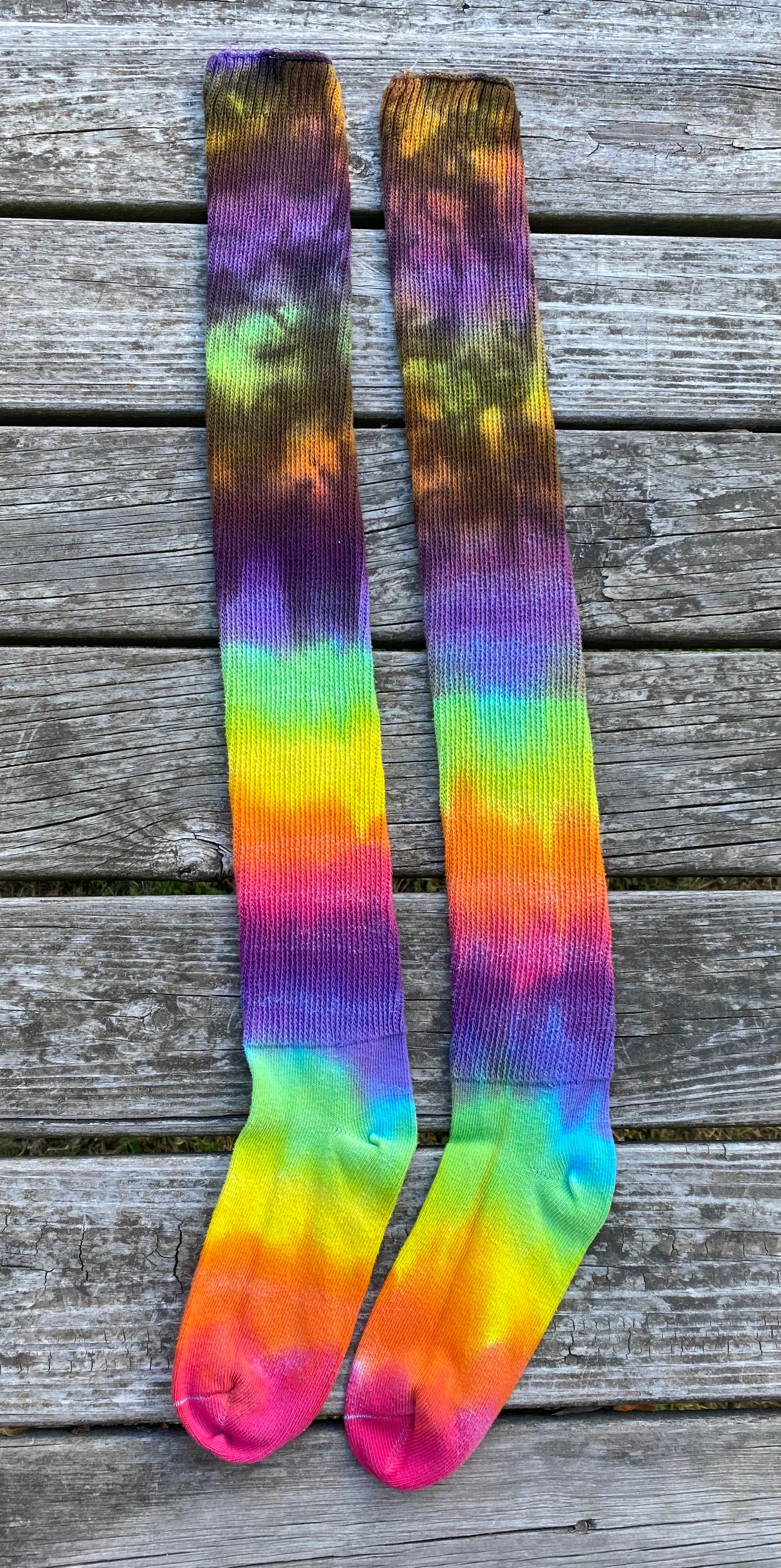 Thigh high adult sized bright rainbow and black socks