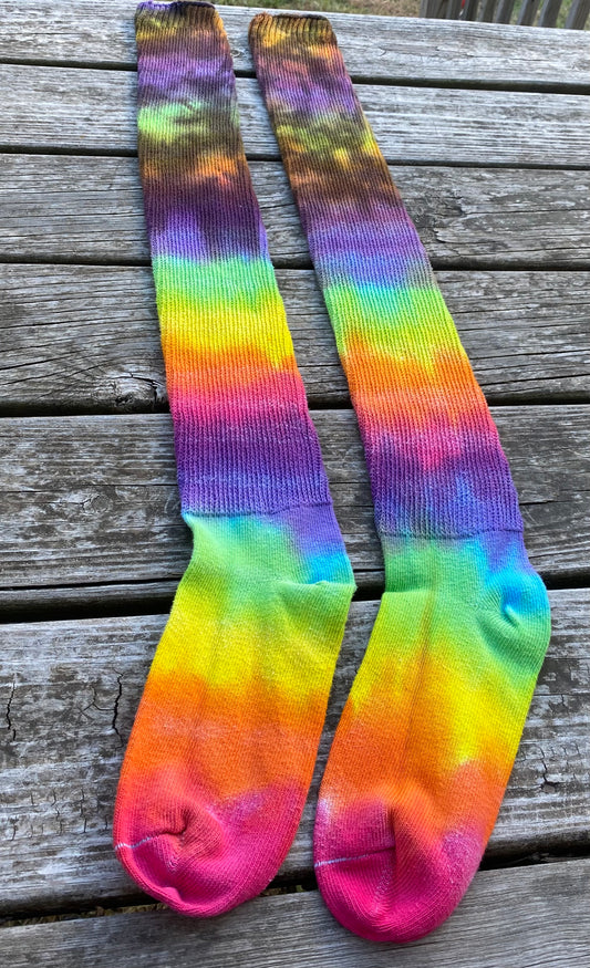 Thigh high adult sized bright rainbow and black socks