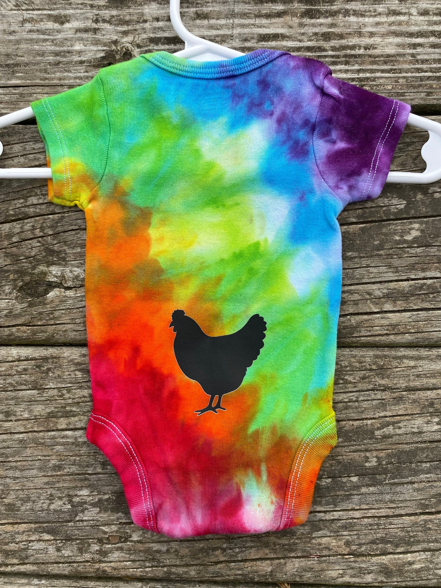 Guess what? Chicken Butt! Baby bodysuit ice dyed rainbow size newborn
